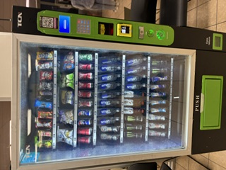 YMP machine in a public-facing hallway